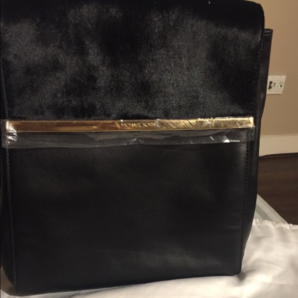 Leather and faux fur MK backpack